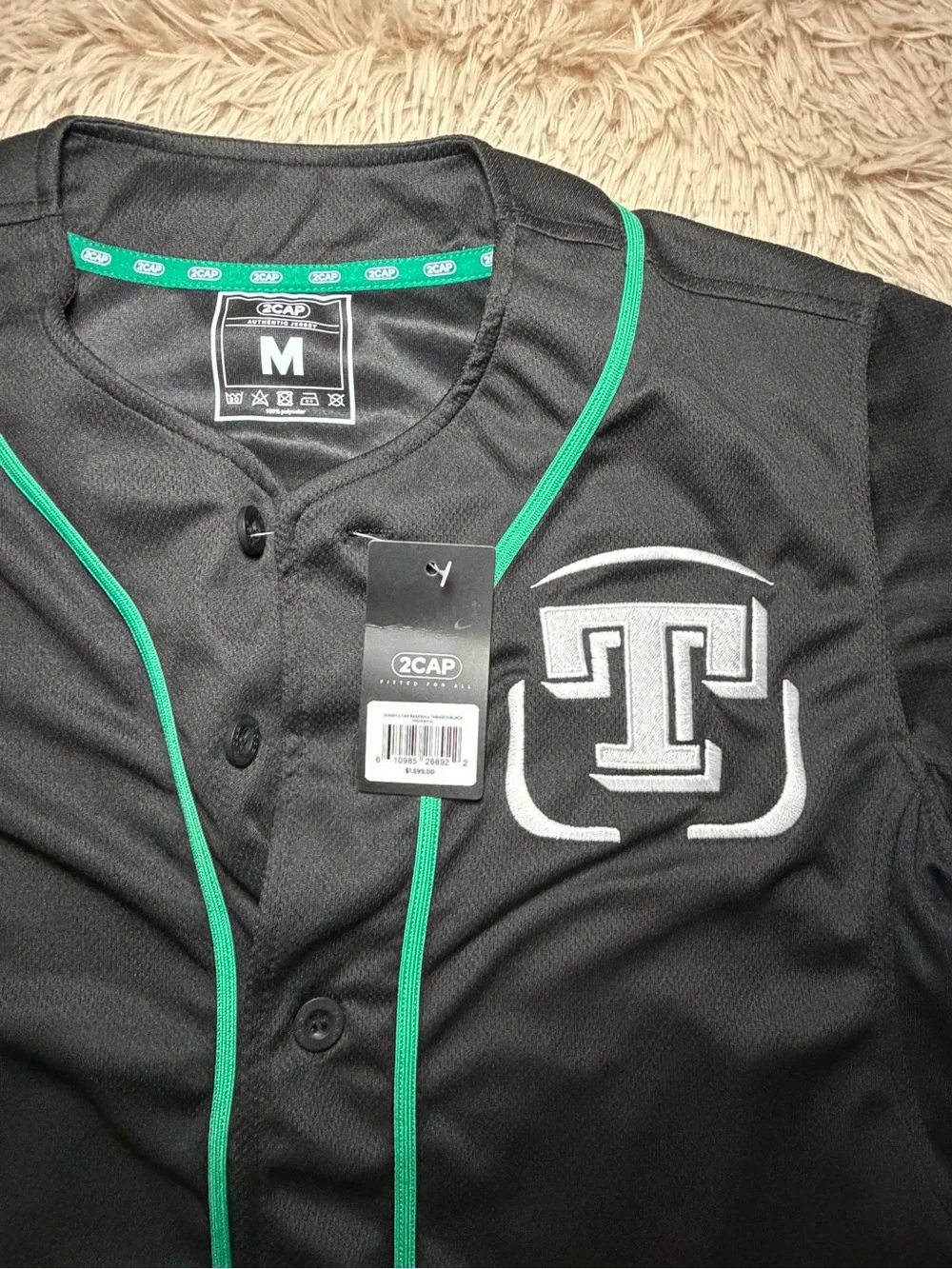 Black and Green Baseball-Style Jersey with 'T' Logo